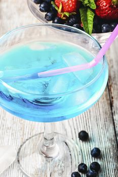 Alcohol in stylish blue color glass glass on long stalk