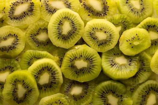 Fresh organic Kiwi Fruit Slices arranged showing the pips & structure