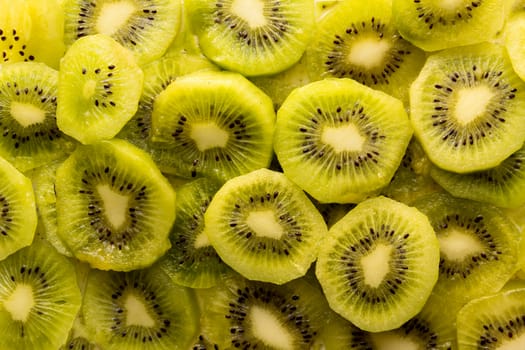 Fresh organic Kiwi Fruit Slices arranged showing the pips & structure