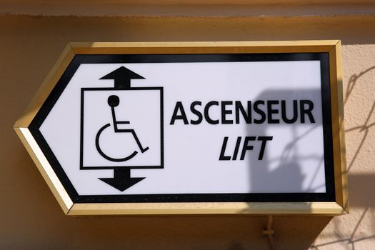 Sign Showing Direction for the Lift in English and French
