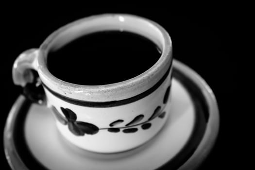 Coffee in old vintage cup in black and white