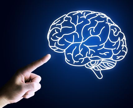 Human hand pointing with finger at brain icon on blue