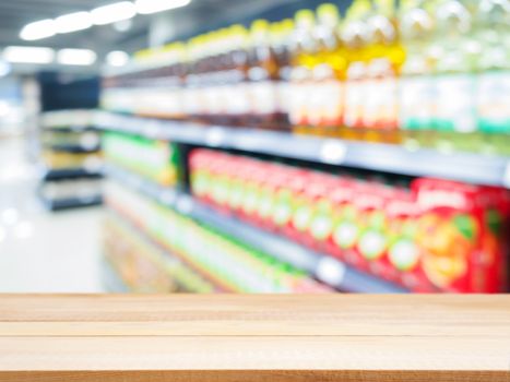 Wooden board empty table in front of blurred background. Perspective light wood over blur in supermarket - can be used for display or montage your products. Mock up for display of product.