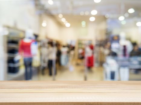 Wooden board empty table in front of blurred background. Perspective light wood over blur in shopping store - can be used for display or montage your products. Mock up for display of product.