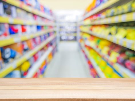 Wooden board empty table in front of blurred background. Perspective light wood over blur in kids toys store - can be used for display or montage your products. Mock up for display of product.