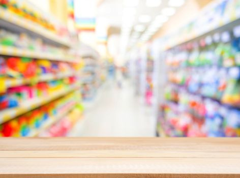 Wooden board empty table in front of blurred background. Perspective light wood over blur in kids toys store - can be used for display or montage your products. Mock up for display of product.