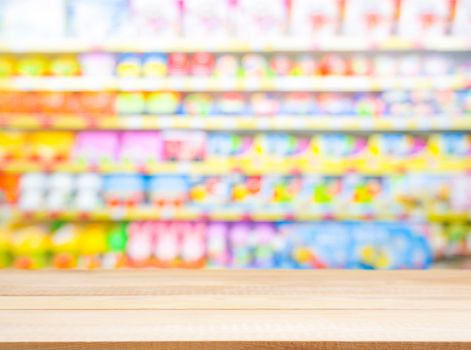 Wooden board empty table in front of blurred background. Perspective light wood over blur in kids toys store - can be used for display or montage your products. Mock up for display of product.