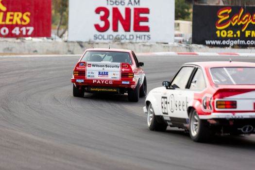 MELBOURNE, WINTON/AUSTRALIA, 22 MAY , 2016: Classic race cars rouding turn 1 at Winton.