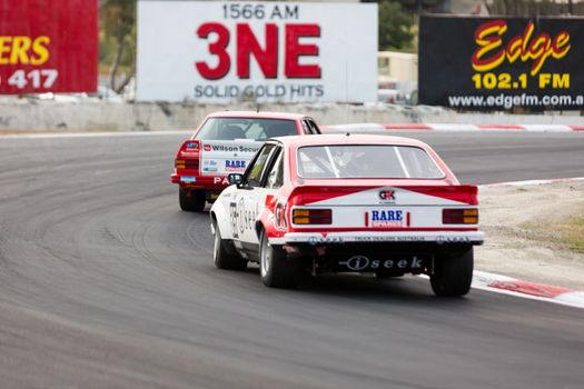 MELBOURNE, WINTON/AUSTRALIA, 22 MAY , 2016: Classic race cars rouding turn 1 at Winton.