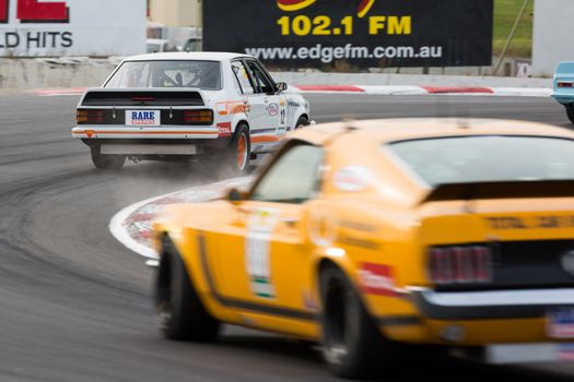 MELBOURNE, WINTON/AUSTRALIA, 22 MAY , 2016: Classic race cars rouding turn 1 at Winton.