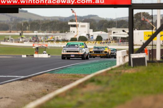 MELBOURNE, WINTON/AUSTRALIA, 22 MAY , 2016: Classic race cars coming into turn 1 at Winton.