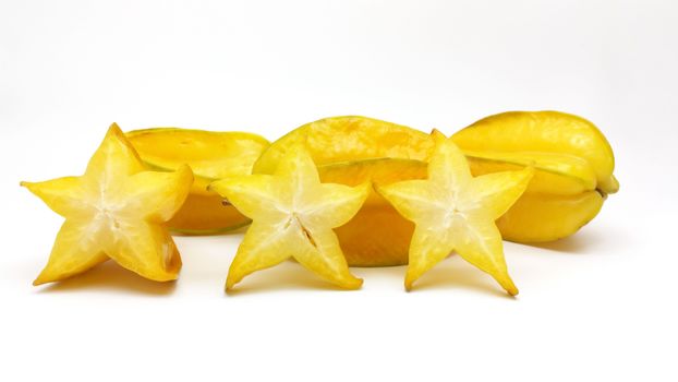 Carambola fruit with slices on white background