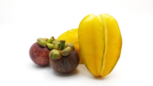 Carambola (starfruit) and mangosteens - the asian fruit on white background