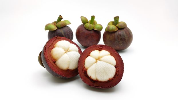 fresh mangosteen - the seasonal asian fruit on white background

