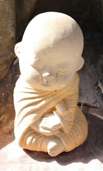 Statue neophyte on the tree in the temple.