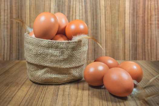 Eggs in basket on wood.eggs.egg.brown.rawfood.