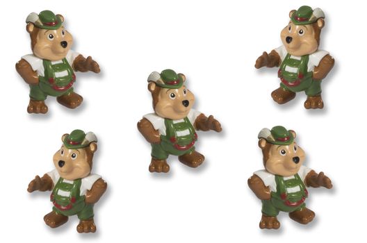 toy beaver in green pants and a white shirt indicates the direction