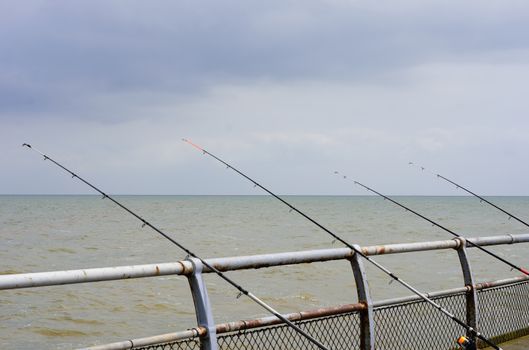 Sea fishing rods on pier