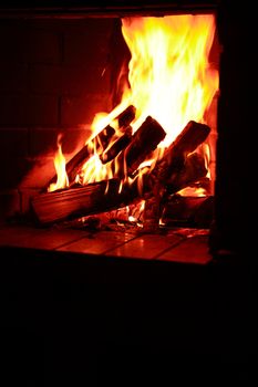 Flame background. Firewood burning in fireplace