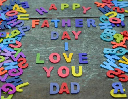 I love you dad message for father, group of colourful letters to happy father day, wooden alphabet wood background