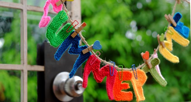 Summer letter hang on rope, summertime background with alphabet on green background