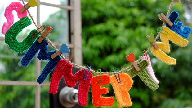 Summer letter hang on rope, summertime background with alphabet on green background