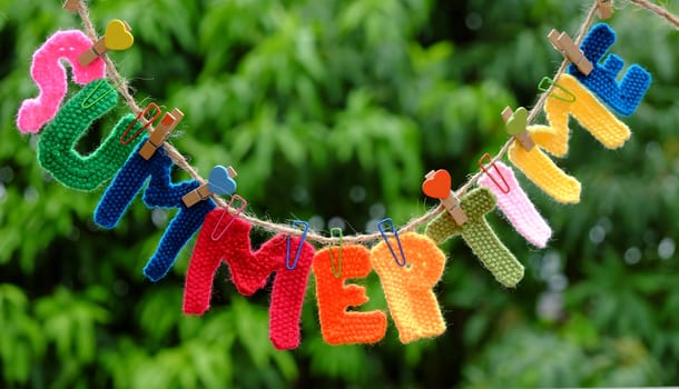 Summer letter hang on rope, summertime background with alphabet on green background
