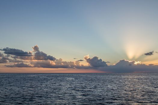 early sunrise on a summer morning at sea