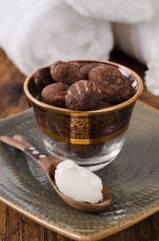 Shea butter nuts in a glass with shea butter