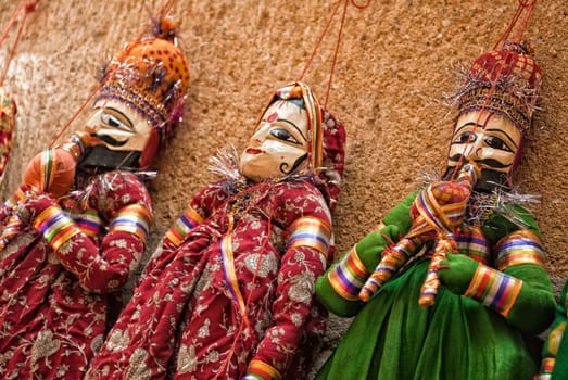 Multicolored puppets on a wall in Jaisalmer

