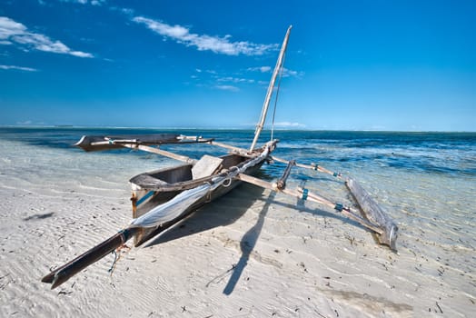 Boat of a fisherman on a tropical beach, Zanzibar, Tanzania