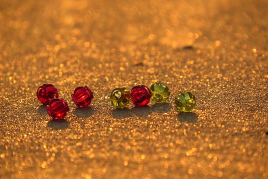 Glass Beads on Golden Sand