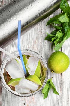 Popular alcoholic cocktail with lime,mint and strawberries