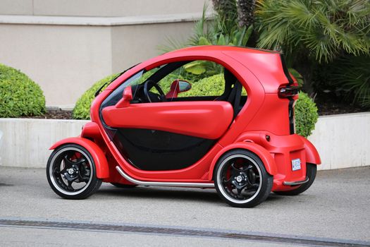 Monte-Carlo, Monaco - May 18, 2016: Red and Black Electric Car Renault Twizy (Tuning) Parked in Front of the Grimaldi Forum in Monaco.