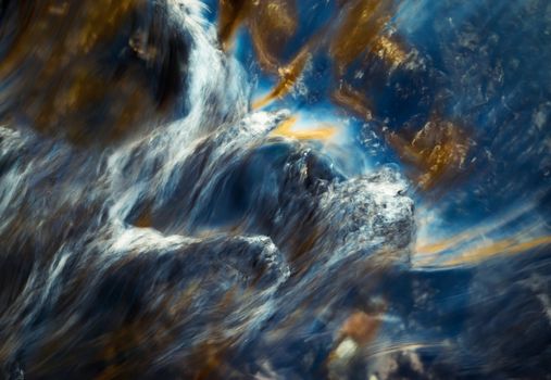 abstract background colorful ripples on the water of the river