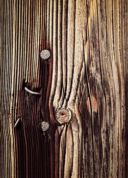 abstract background or texture rusty nail in old wooden board