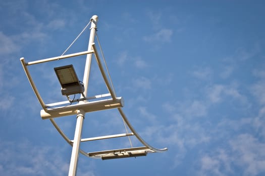 lighting pole shot against blue sky