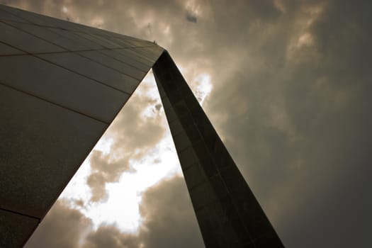 Monument shot in low angle against dramatic cloudy sky