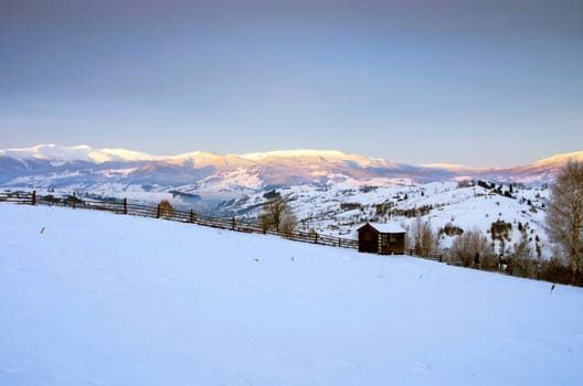 Carpathian mountain valley covered with fresh snow. Majestic landscape. Ukraine, Europe