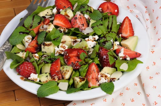 Salad spinach with strawberries, avocado, mint, ricotta and sesame,poppy seeds 