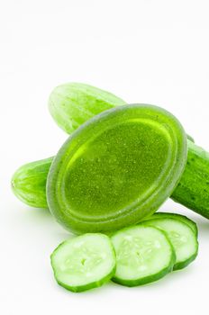 Soap cucumber with fresh cucumber slices on white background.