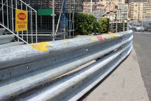 Monte-Carlo, Monaco - April 28, 2016: Monaco Grand Prix 2016 - Safety Barrier Fence Racing on Asphalt Road in Monte-Carlo, Monaco
