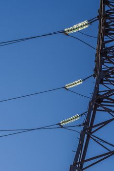 electric insulator on the background of blue sky