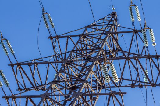 electric insulator on the background of blue sky