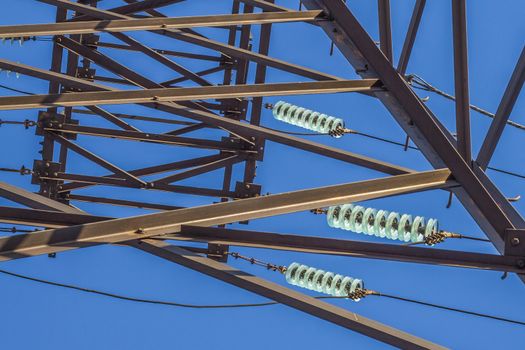 electric insulator on the background of blue sky