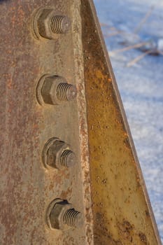 Corrosive rusted bolt with nut. Grunge industrial construction close up.