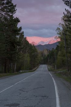 road at sunset ,the mountains in the glow of sunset