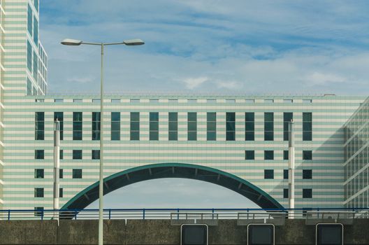 Highway pass right underneath a building in Den Haag, Scheveningen in the Netherlands.
