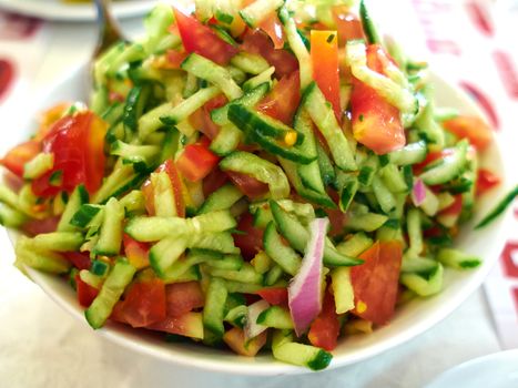 Classic famous Israeli salad made of freshly cut vegetables