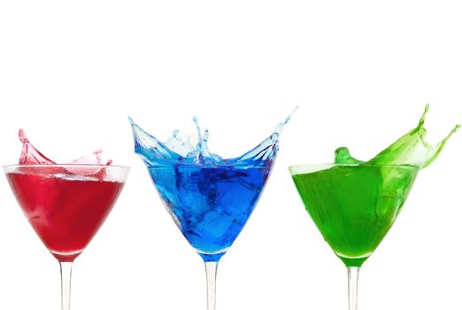 Three different cocktails with a splash over a white background